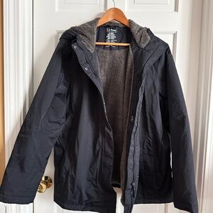 L.L.Bean Women's Winter Warmer coat in black with a fleece lining.
